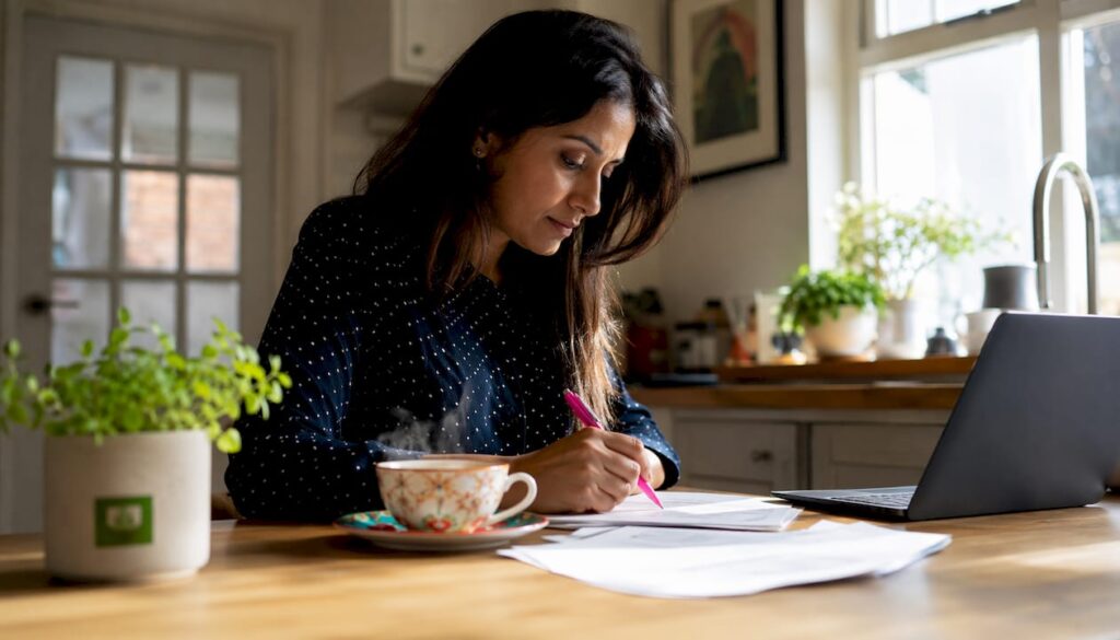 Woman reviewing AI booking checklist at desk