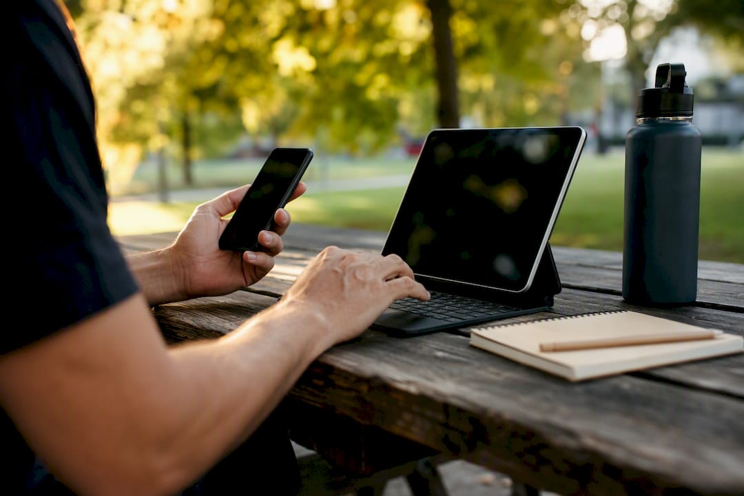 Hands managing local business with devices