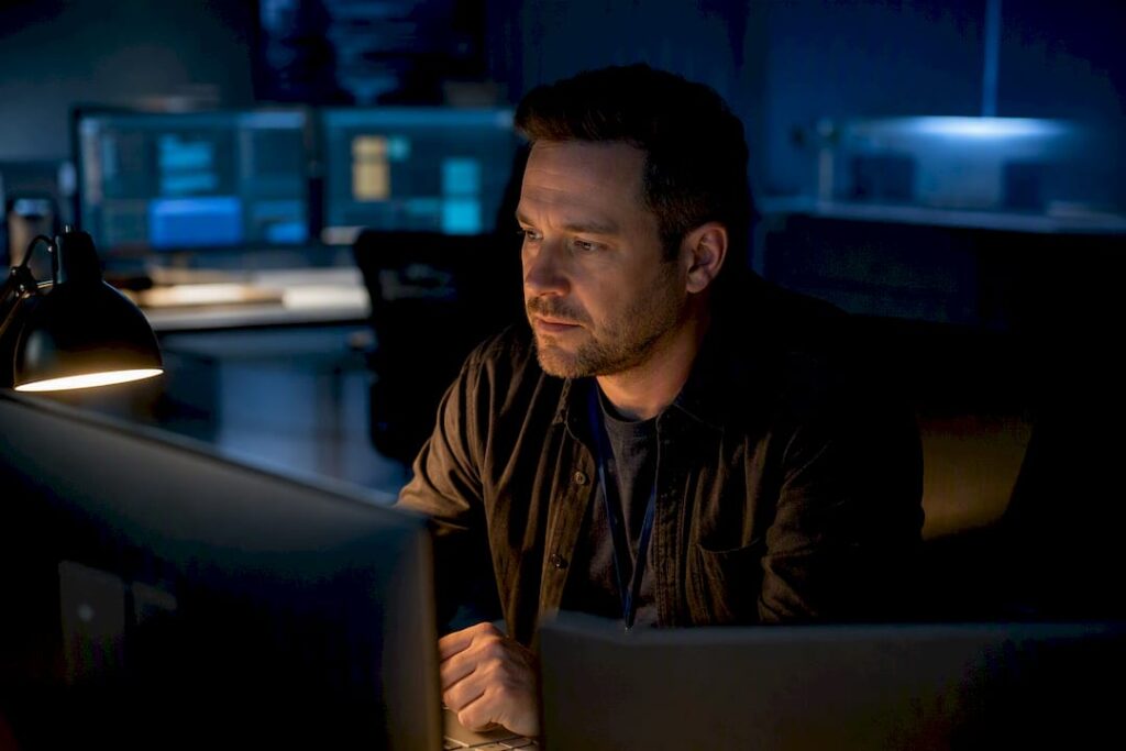 Engineer monitoring overnight IT support alerts